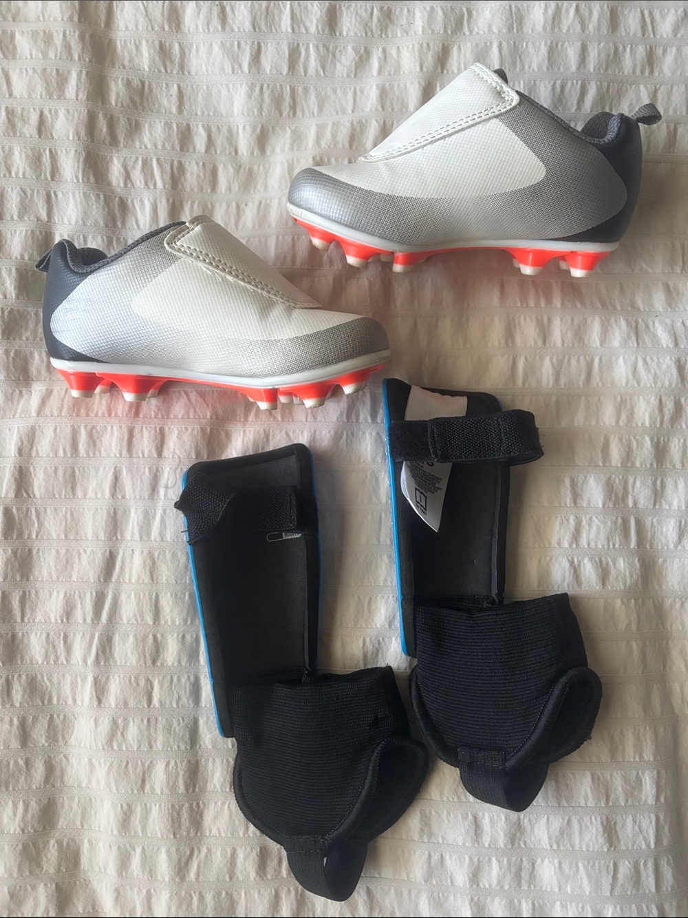 Toddler Kids Soccer Cleats in White and Gray with Blue Adidas Shinguards - Picture 5 of 10